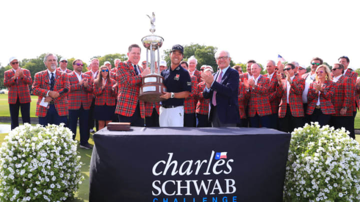 FORT WORTH, TEXAS - MAY 26: Colonial Country Club president Kip Adams (left) presents Kevin Na of the United States with the trophy as Charles Schwab (right) looks on after Na won the 2019 Charles Schwab Challenge at Colonial Country Club on May 26, 2019 in Fort Worth, Texas. (Photo by Tom Pennington/Getty Images)