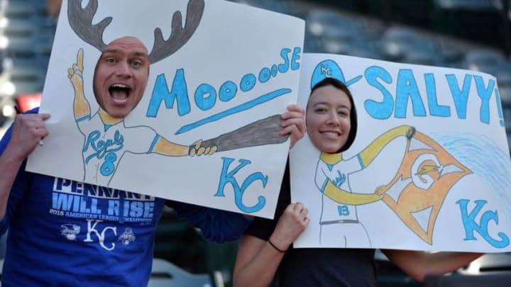 Apr 26, 2016; Anaheim, CA, USA; Kansas Royals fans Steve Nick (left) and Meghan Ketz pose with cutouts of third baseman Mike Moustakas and catcher Salvador Perez (both not pictured) during a MLB game against the Los Angeles Angels at Angel Stadium of Anaheim. Mandatory Credit: Kirby Lee-USA TODAY Sports