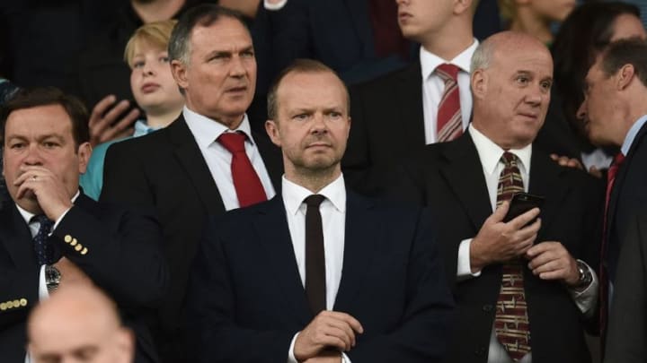 Manchester United's executive vice-chairman Ed Woodward (C) awaits kick-off in the English Premier League football match between Manchester United and Manchester City at Old Trafford in Manchester, north west England, on September 10, 2016.