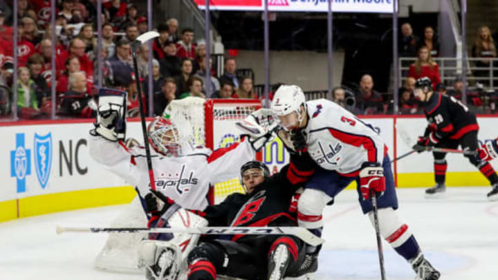 RALEIGH, NC – JANUARY 03: Carolina Hurricanes Left Wing Nino Niederreiter (21) gets tangled up with Washington Capitals Goalie Ilya Samsonov (30) and Washington Capitals Defenceman Nick Jensen (3) in front of the net during an NHL game between the Carolina Hurricanes and the Washington Capitals on January 3, 2020, at the PNC Arena in Raleigh, NC. (Photo by John McCreary/Icon Sportswire via Getty Images)