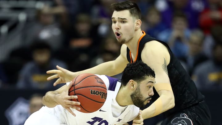KANSAS CITY, MISSOURI – MARCH 13: Alex Robinson #25 of the TCU Horned Frogs drives as Thomas Dziagwa #4 of the Oklahoma State Cowboys defends during the first round of the Big 12 Basketball Tournament at the Sprint Center on March 13, 2019 in Kansas City, Missouri. (Photo by Jamie Squire/Getty Images)