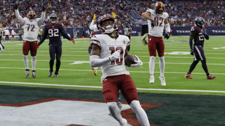 HOUSTON, TEXAS - NOVEMBER 20: Curtis Samuel #10 of the Washington Commanders scores a rushing touchdown in the second quarter of a game against the Houston Texans at NRG Stadium on November 20, 2022 in Houston, Texas. (Photo by Bob Levey/Getty Images)
