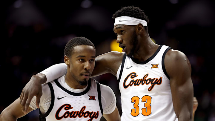 NCAA Basketball Moussa Cisse #33 and Bryce Thompson #1 of the Oklahoma State Cowboys (Photo by Jamie Squire/Getty Images)