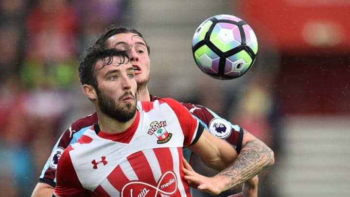 Southampton’s English midfielder Sam McQueen (L) vies with Burnley’s Australian midfielder Aiden O’Neill during the English Premier League football match between Southampton and Burnley at St Mary’s Stadium in Southampton, southern England on October 16, 2016. / AFP / GLYN KIRK / RESTRICTED TO EDITORIAL USE. No use with unauthorized audio, video, data, fixture lists, club/league logos or ‘live’ services. Online in-match use limited to 75 images, no video emulation. No use in betting, games or single club/league/player publications. / (Photo credit should read GLYN KIRK/AFP/Getty Images)