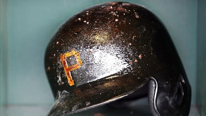 April 16, 2013; Pittsburgh, PA, USA; Batting helmet belonging to Pittsburgh Pirates catcher Michael McKenry (not pictured) sits in the dugout prior to the game against the St. Louis Cardinals at PNC Park. Mandatory Credit: Charles LeClaire-USA TODAY Sports