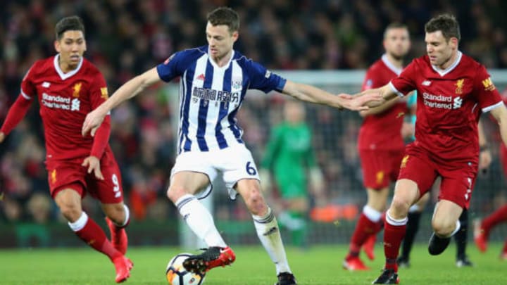 Jonny Evans of West Bromwich Albion holds off James Milner during The Emirates FA Cup Fourth Round  (Pic by Alex Livesey for Getty Images)