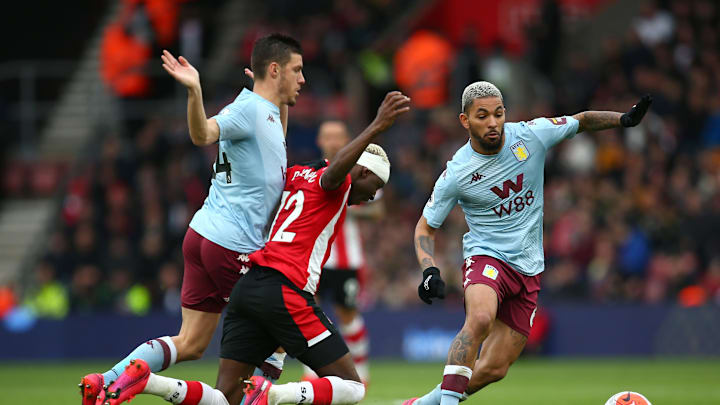 SOUTHAMPTON, ENGLAND – FEBRUARY 22: Moussa Djenepo of Southampton is fouled by Frederic Guilbert of Aston Villa during the Premier League match between Southampton FC and Aston Villa at St Mary’s Stadium on February 22, 2020 in Southampton, United Kingdom. (Photo by Charlie Crowhurst/Getty Images)