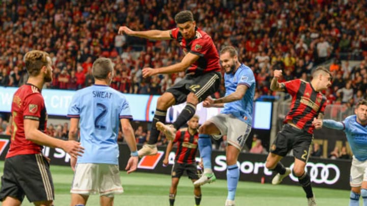 ATLANTA, GA NOVEMBER 11: Atlanta’s Miles Robinson (12) and NYCFC’s Maxime Chanot (4) go high to get a corner kick during the MLS Eastern Conference semifinal match between Atlanta United and NYCFC on November 11th, 2018 at Mercedes-Benz Stadium in Atlanta, GA. Atlanta United FC defeated New York City FC by a score of 3 to 1 to advance in the playoffs. (Photo by Rich von Biberstein/Icon Sportswire via Getty Images)