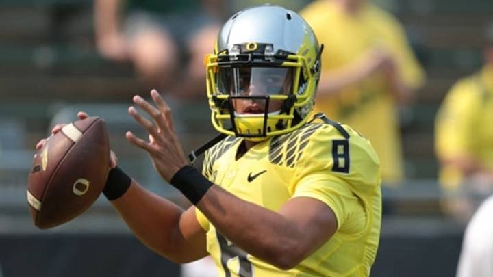 Sep 6, 2014; Eugene, OR, USA; Oregon Ducks quarterback Marcus Mariota (8) throws the ball before the game against the Michigan State Spartans at Autzen Stadium. Mandatory Credit: Scott Olmos-USA TODAY Sports