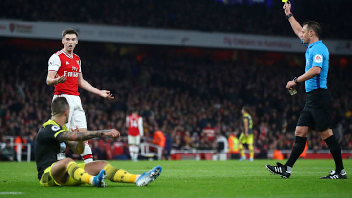 LONDON, ENGLAND - NOVEMBER 23: Kieran Tierney of Arsenal reacts after a receiving a yellow card and conceding a penalty for a foul on Danny Ings of Southampton during the Premier League match between Arsenal FC and Southampton FC at Emirates Stadium on November 23, 2019 in London, United Kingdom. (Photo by Julian Finney/Getty Images)