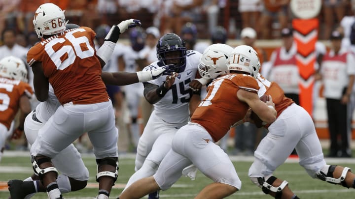 AUSTIN, TX – SEPTEMBER 22: Ben Banogu #15 of the TCU Horned Frogs pressures Sam Ehlinger #11 of the Texas Longhorns in the second half at Darrell K Royal-Texas Memorial Stadium on September 22, 2018 in Austin, Texas. (Photo by Tim Warner/Getty Images)