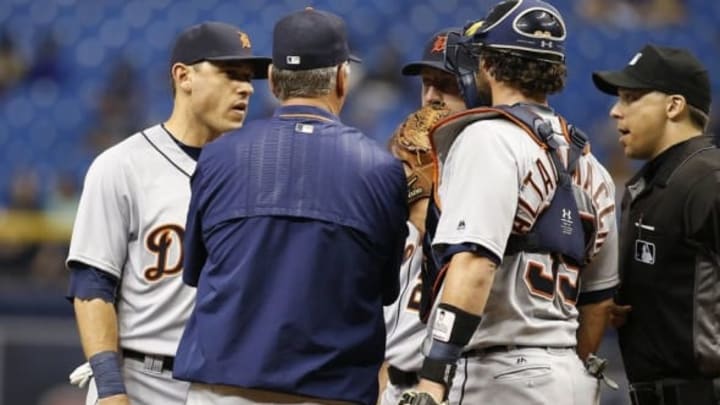 Jun 30, 2016; St. Petersburg, FL, USA; Detroit Tigers pitching coach Rich Dubee (52) comes out to talk with starting pitcher Jordan Zimmermann (27), catcher Jarrod Saltalamacchia (39) and second baseman Ian Kinsler (3) during the third inning against the Tampa Bay Rays at Tropicana Field. Mandatory Credit: Kim Klement-USA TODAY Sports