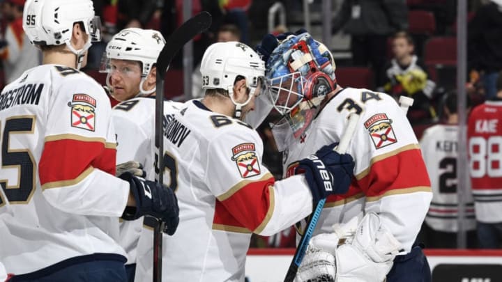 CHICAGO, IL - DECEMBER 23: Evgenii Dadonov #63 and goalie James Reimer #34 of the Florida Panthers celebrate after defeating the Chicago Blackhawks 6-3 at the United Center on December 23, 2018 in Chicago, Illinois. (Photo by Bill Smith/NHLI via Getty Images)