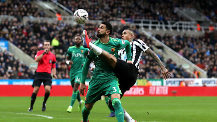 NEWCASTLE UPON TYNE, ENGLAND - JANUARY 26: Miguel Britos of Watford is challenged by Kenedy of Newcastle United during the FA Cup Fourth Round match between Newcastle United and Watford at St James' Park on January 26, 2019 in Newcastle upon Tyne, United Kingdom. (Photo by Ian MacNicol/Getty Images)
