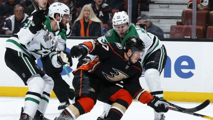 ANAHEIM, CA - FEBRUARY 21: Rickard Rakell #67 of the Anaheim Ducks battles for position against Esa Lindell #23 and Tyler Seguin #91 of the Dallas Stars during the game on February 21, 2018 at Honda Center in Anaheim, California. (Photo by Debora Robinson/NHLI via Getty Images)