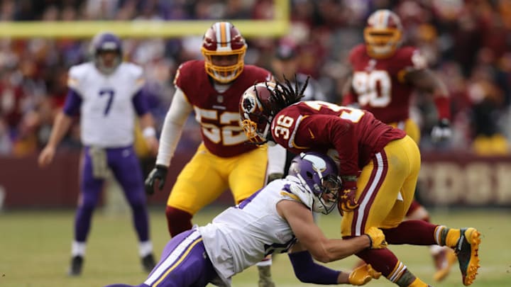 LANDOVER, MD - NOVEMBER 12: Free safety D.J. Swearinger #36 of the Washington Redskins is tackled by wide receiver Adam Thielen #19 of the Minnesota Vikings during an interception return during the fourth quarter against the Minnesota Vikings at FedExField on November 12, 2017 in Landover, Maryland. (Photo by Patrick Smith/Getty Images)
