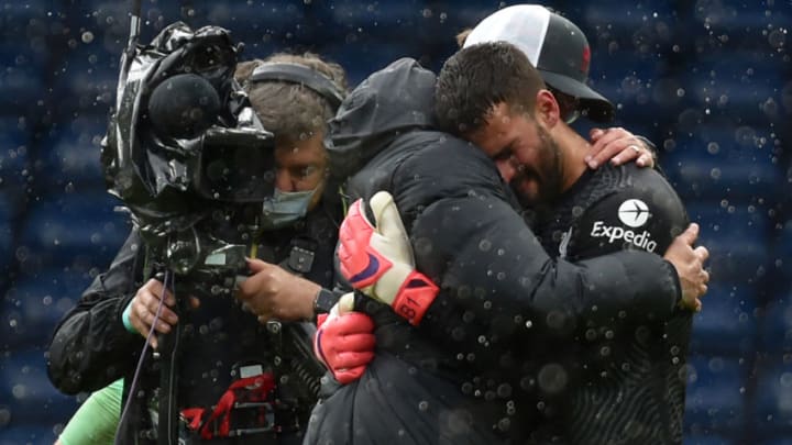 Liverpool's Brazilian goalkeeper Alisson Becker and German manager Jurgen Klopp (Photo by RUI VIEIRA/POOL/AFP via Getty Images)