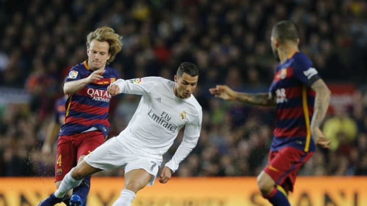 BARCELONA, SPAIN - APRIL 02: Cristiano Ronaldo of Real Madrid and Ivan Rakitic of Barcelona fc compete for the ball during the La Liga match between FC Barcelona and Real Madrid CF at Camp Nou on April 2, 2016 in Barcelona, Spain. (Photo by Helios de la Rubia/Real Madrid via Getty Images)