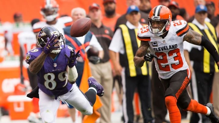 Sep 18, 2016; Cleveland, OH, USA; Baltimore Ravens wide receiver Steve Smith (89) makes a first-down reception under pressure from Cleveland Browns cornerback Joe Haden (23) during the third quarter at FirstEnergy Stadium. The Ravens defeated the Browns 25-20. Mandatory Credit: Scott R. Galvin-USA TODAY Sports