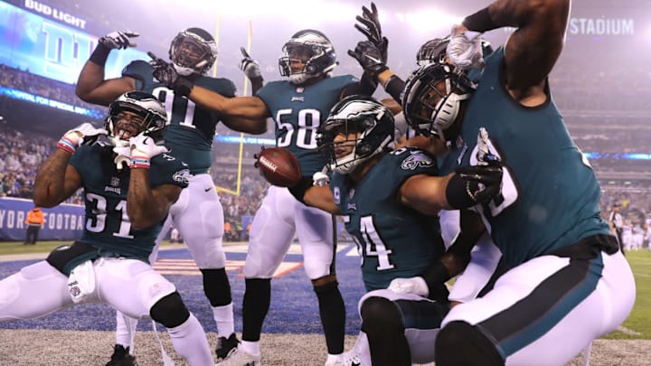 EAST RUTHERFORD, NJ - OCTOBER 11: Olivier Vernon #54 of the Philadelphia Eagles celebrates with teammates after making an interception on a pass intended for Scott Simonson of the New York Giants during the first quarter at MetLife Stadium on October 11, 2018 in East Rutherford, New Jersey. (Photo by Elsa/Getty Images)