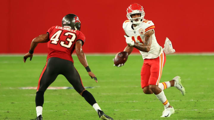 TAMPA, FLORIDA – NOVEMBER 29: Demarcus Robinson #11 of the Kansas City Chiefs looks to gain extra yardage in the fourth quarter against Ross Cockrell #43 of the Tampa Bay Buccaneers during their game at Raymond James Stadium on November 29, 2020 in Tampa, Florida. (Photo by Mike Ehrmann/Getty Images)