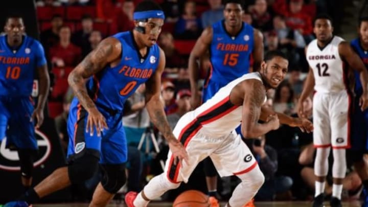 Feb 16, 2016; Athens, GA, USA; Georgia Bulldogs guard Charles Mann (4) loses the ball to Florida Gators guard Kasey Hill (0) during the first half at Stegeman Coliseum. Mandatory Credit: Dale Zanine-USA TODAY Sports