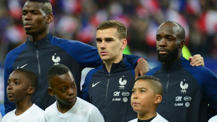 PARIS, FRANCE - MARCH 29: The France players Paul Pogba (L), Antoine Grietzmann (C) and Lassana Diarra (R)pose during the national hyme before the International Friendly match between France and Russia held at Stade de France on March 29, 2016 in Paris, France. (Photo by Frederic Stevens/Getty Images)