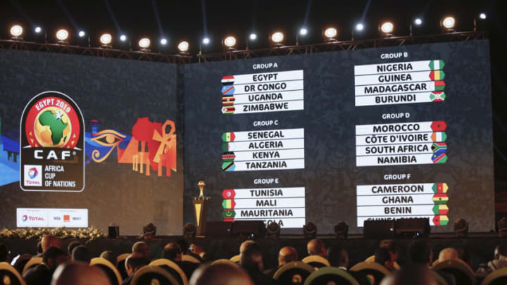 12 April 2019, Egypt, Giza: The group stage of the 2019 Africa Cup of Nations are seen displayed on the screen during the draw for the championship, scheduled to take place in Egypt between 21 June and 19 July 2019, at the Pyramids of Giza. Photo: Ahmed Ramadan/dpa (Photo by Ahmed Ramadan/picture alliance via Getty Images)