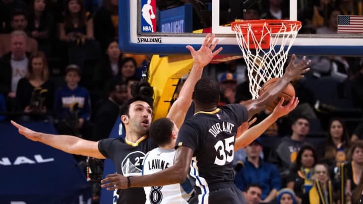 Nov 26, 2016; Oakland, CA, USA; Minnesota Timberwolves guard Zach LaVine (8) shoots between Golden State Warriors center Zaza Pachulia (27) and forward Kevin Durant (35) during the fourth quarter at Oracle Arena. The Golden State Warriors defeated the Minnesota Timberwolves 115-102. Mandatory Credit: Kelley L Cox-USA TODAY Sports