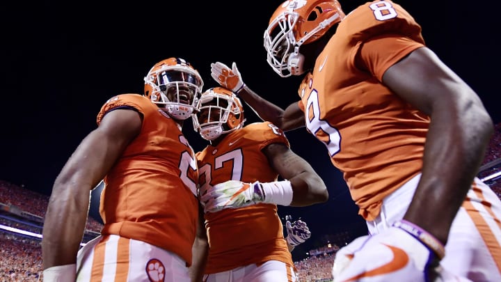 CLEMSON, SC – SEPTEMBER 09: Quarterback Kelly Bryant #2, wide receiver Deon Cain #8, and tight end D.J. Greenlee #87 of the Clemson Tigers celebrate following Bryant’s touchdown to start the second half of play during the Tigers’ game football game against the Auburn Tigers at Memorial Stadium on September 9, 2017 in Clemson, South Carolina. (Photo by Mike Comer/Getty Images)