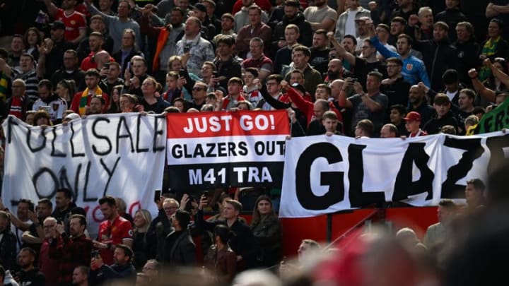 Manchester united fans hold a banner calling for the club's owners, the Glazers, to leave the club, ahead of the English Premier League football match between Manchester United and Everton at Old Trafford in Manchester, north west England, on April 8, 2023. (Photo by Paul ELLIS / AFP) / RESTRICTED TO EDITORIAL USE. No use with unauthorized audio, video, data, fixture lists, club/league logos or 'live' services. Online in-match use limited to 120 images. An additional 40 images may be used in extra time. No video emulation. Social media in-match use limited to 120 images. An additional 40 images may be used in extra time. No use in betting publications, games or single club/league/player publications. / (Photo by PAUL ELLIS/AFP via Getty Images)