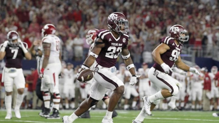 Sep 24, 2016; Dallas, TX, USA; Texas A&M Aggies defensive back Armani Watts (23) celebrates recovering a fumble on the one yard line against the Arkansas Razorbacks in the second quarter at AT&T Stadium. Mandatory Credit: Tim Heitman-USA TODAY Sports