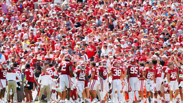 NORMAN, OK – SEPTEMBER 18: The Oklahoma Sooners and their fans celebrate a 100-yard return on a blocked point-after-touchdown for two points against the Nebraska Cornhuskers in the third quarter at Gaylord Family Oklahoma Memorial Stadium on September 18, 2021 in Norman, Oklahoma. Oklahoma won 23-16. (Photo by Brian Bahr/Getty Images)