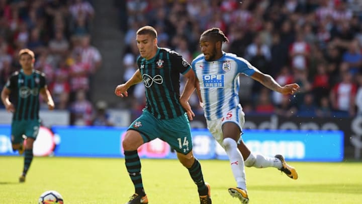 HUDDERSFIELD, ENGLAND - AUGUST 26: Kasey Palmer of Huddersfield Town tackles Oriol Romeu of Southampton during the Premier League match between Huddersfield Town and Southampton at John Smith's Stadium on August 26, 2017 in Huddersfield, England. (Photo by Tony Marshall/Getty Images)