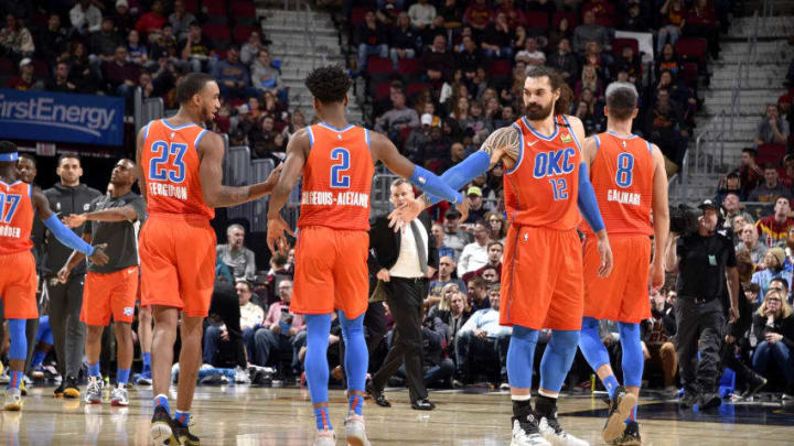 JANUARY 4: Shai Gilgeous-Alexander #2 and Steven Adams #12 of OKC Thunder high five each other during a game against the Cleveland Cavaliers (Photo by David Liam Kyle/NBAE via Getty Images)