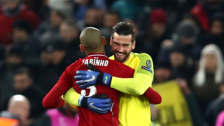 LIVERPOOL, ENGLAND - DECEMBER 11: Alisson and Fabinho of Liverpool celebrate after the UEFA Champions League Group C match between Liverpool and SSC Napoli at Anfield on December 11, 2018 in Liverpool, United Kingdom. (Photo by Clive Brunskill/Getty Images)