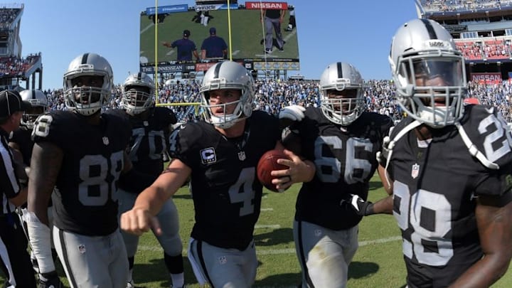 Sep 25, 2016; Nashville, TN, USA; Oakland Raiders players Clive Walford (88), Kelechi Osemele (70), Derek Carr (4), Gabe Jackson (66) and Latavius Murray (28) celebrate after defeating the Tennessee Titans 17-10 at Nissan Stadium. Mandatory Credit: Kirby Lee-USA TODAY Sports