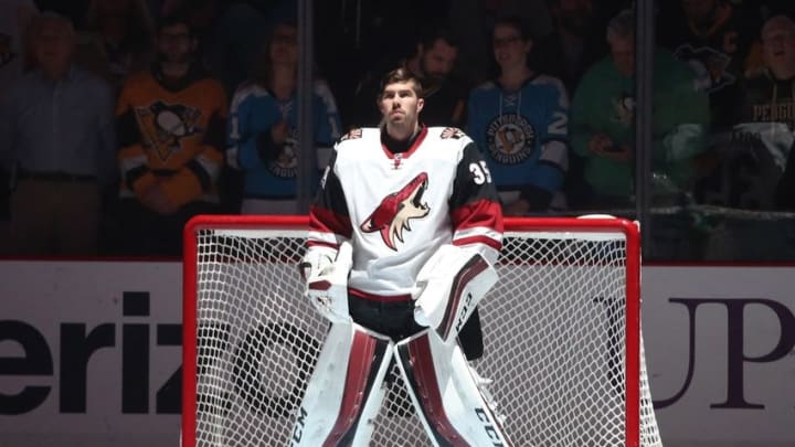 Feb 29, 2016; Pittsburgh, PA, USA; Arizona Coyotes goalie Louis Domingue (35) stands for the national anthem before playing the Pittsburgh Penguins at the CONSOL Energy Center. Mandatory Credit: Charles LeClaire-USA TODAY Sports