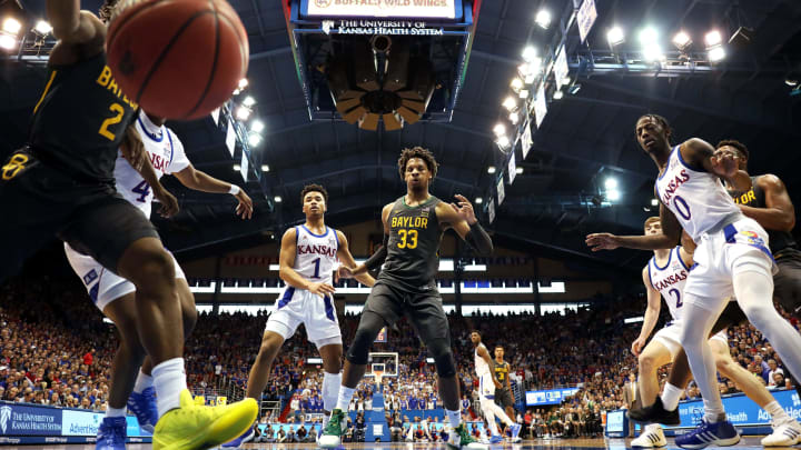 LAWRENCE, KANSAS – JANUARY 11: Devon Dotson #1, Marcus Garrett #0 of the Kansas Jayhawks, and Freddie Gillespie #33 of the Baylor Bears watch as the ball goes out-of-bounds during the game at Allen Fieldhouse on January 11, 2020 in Lawrence, Kansas. (Photo by Jamie Squire/Getty Images)