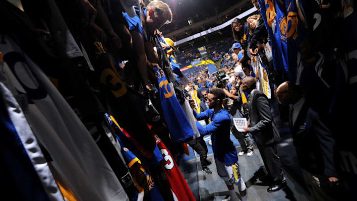 OAKLAND, CA - SEPTEMBER 30: Stephen Curry #30 of the Golden State Warriors signs autographs before the game against the Denver Nuggets during a preseason game on September 30, 2017 at ORACLE Arena in Oakland, California. NOTE TO USER: User expressly acknowledges and agrees that, by downloading and or using this photograph, user is consenting to the terms and conditions of Getty Images License Agreement. Mandatory Copyright Notice: Copyright 2017 NBAE (Photo by Noah Graham/NBAE via Getty Images)