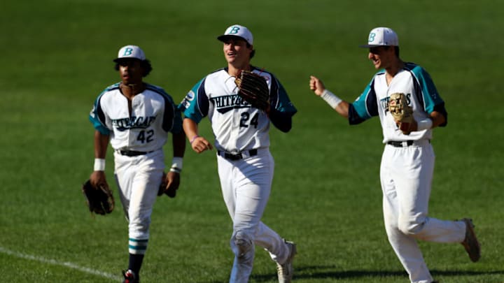 BREWSTER, MA - AUGUST 13: From left, Martin Costes, Hunter Bishop and AJ Graffanino run to the dugout during the seventh inning of game three of the Cape Cod League Championship Series at Stony Brook Field on August 13, 2017 in Brewster, Massachusetts. The Cape Cod League was founded in 1885 and is the premier summer baseball league for college athletes. Over 1100 of these student athletes have gone on to compete in MLB including Chris Sale, Carlton Fisk, Joe Girardi, Nomar Garciaparra and Jason Varitek. The chance to see future big league stars up close makes Cape Cod League games a popular activity for the families in each of the 10 towns on the Cape to host a team. Each team is a non-profit organization, relying on labor from volunteers and donations from spectators to run each year. (Photo by Maddie Meyer/Getty Images)