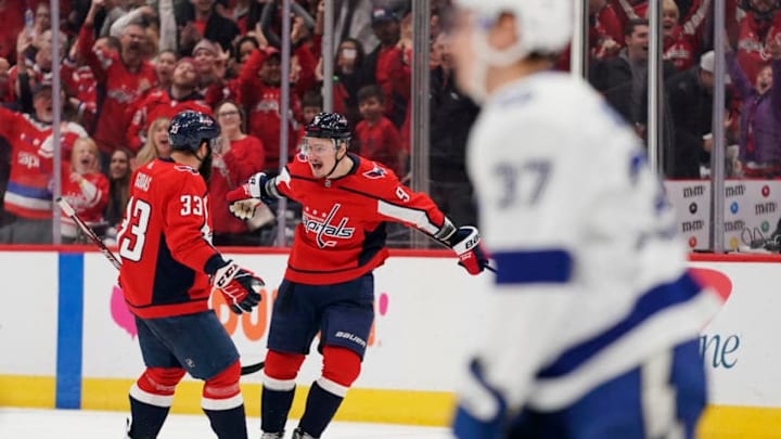 WASHINGTON, DC - DECEMBER 21: Dmitry Orlov #9 of the Washington Capitals celebrates with Radko Gudas #33 after scoring a goal against the Tampa Bay Lightning in the third period at Capital One Arena on December 21, 2019 in Washington, DC. (Photo by Patrick McDermott/NHLI via Getty Images)