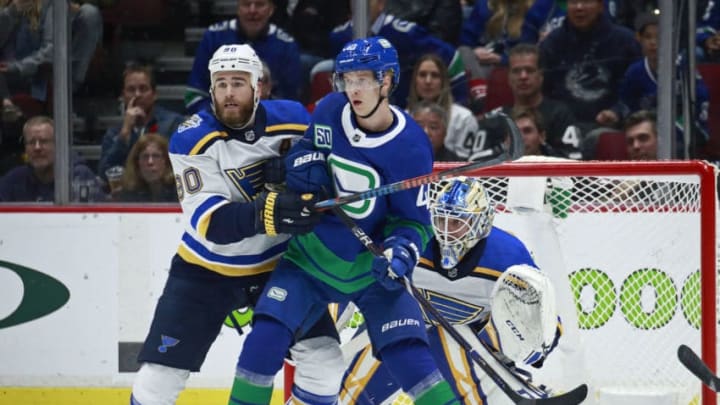 VANCOUVER, BC - NOVEMBER 5: Ryan O'Reilly #90 of the St. Louis Blues checks Elias Pettersson #40 of the Vancouver Canucks during their NHL game at Rogers Arena November 5, 2019 in Vancouver, British Columbia, Canada. (Photo by Jeff Vinnick/NHLI via Getty Images)