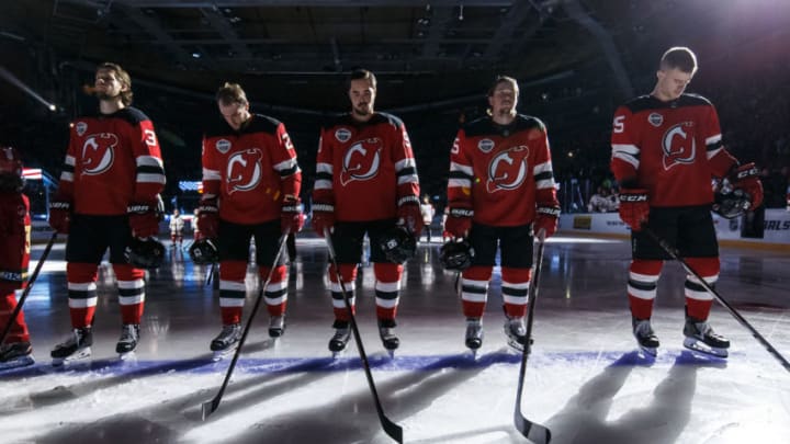 GOTHENBURG, SWE - OCTOBER 6: Pavel Zacha #37, Stefan Noesen #23, Marcus Johansson #90, Sami Vatanen #45 and Mirco Mueller #25 of the New Jersey Devils stand at attention during the singing of the national anthems prior to a game against the Edmonton Oilers at Scandinavium on October 6, 2018 in Gothenburg, Sweden. (Photo by Andre Ringuette/NHLI via Getty Images)