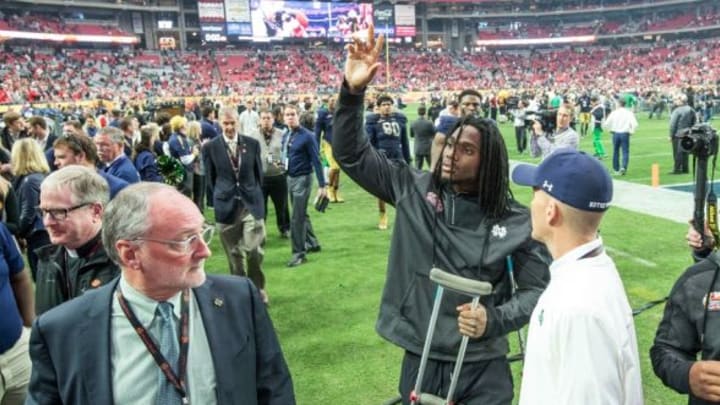 Jan 1, 2016; Glendale, AZ, USA; Notre Dame Fighting Irish linebacker Jaylon Smith (9) waves as he leaves the field following the 2016 Fiesta Bowl at University of Phoenix Stadium. Smith was injured in the first quarter and left the game. The Ohio State Buckeyes defeated Notre Dame 44-28. Mandatory Credit: Matt Cashore-USA TODAY Sports