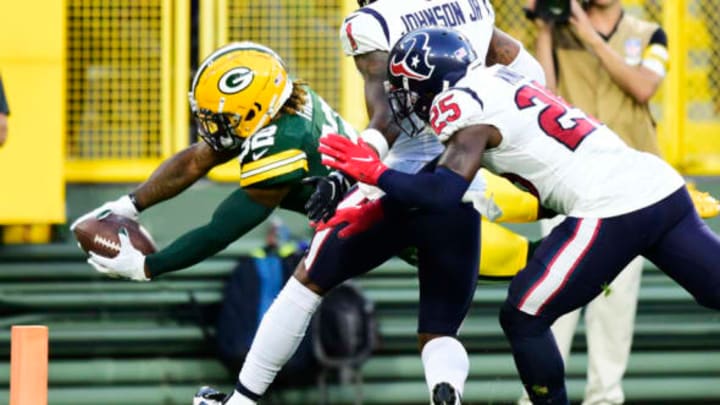 GREEN BAY, WISCONSIN – AUGUST 14: Kylin Hill #32 of the Green Bay Packers dives for a touchdown against the Houston Texans in the first half during the preseason game at Lambeau Field on August 14, 2021 in Green Bay, Wisconsin. (Photo by Patrick McDermott/Getty Images)