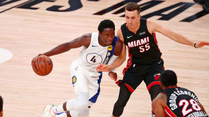 Victor Oladipo (4) dribbles as Miami Heat guard Duncan Robinson (55) defends(Kim Klement-USA TODAY Sports)