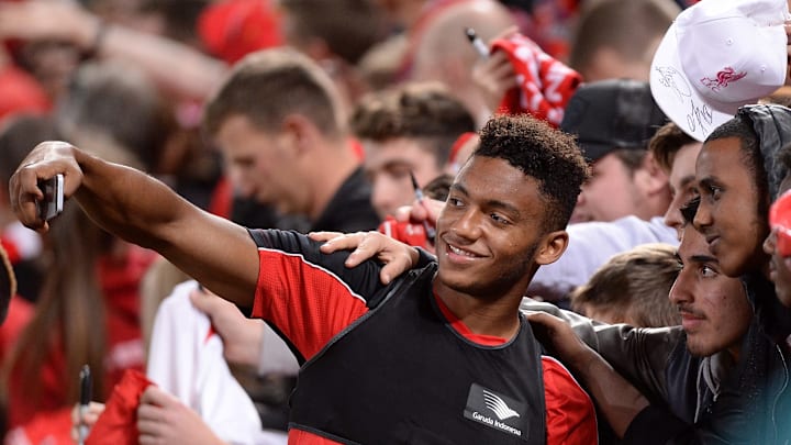 BRISBANE, AUSTRALIA - JULY 16: Joe Gomez takes a selfie with fans during a Liverpool FC training session at Suncorp Stadium on July 16, 2015 in Brisbane, Australia. (Photo by Bradley Kanaris/Getty Images)