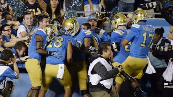 Nov 22, 2014; Pasadena, CA, USA; UCLA Bruins wide receiver Thomas Duarte (18) celebrates with teammates after scoring a touchdown against the Southern California Trojans during the first half at the Rose Bowl. Mandatory Credit: Richard Mackson-USA TODAY Sports