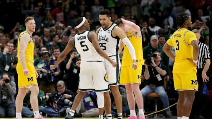CHICAGO, ILLINOIS - MARCH 17: Cassius Winston #5 and Kenny Goins #25 of the Michigan State Spartans celebrate in the second half against the Michigan Wolverines during the championship game of the Big Ten Basketball Tournament at the United Center on March 17, 2019 in Chicago, Illinois. (Photo by Dylan Buell/Getty Images)